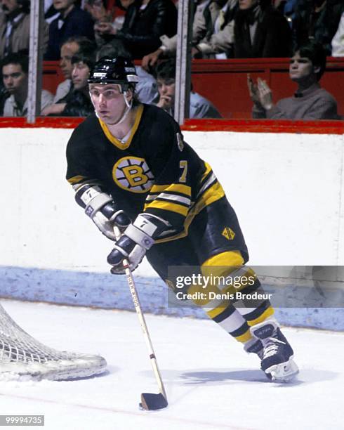 Raymond Bourque of the Boston Bruins skates with the puck against the Montreal Canadiens in the 1980's at the Montreal Forum in Montreal, Quebec,...