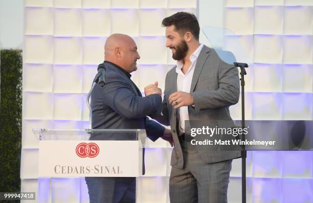 Jay Glazer and honoree Baker Mayfield speak onstage during the 33rd Annual Cedars-Sinai Sports Spectacular at The Compound on July 15, 2018 in...