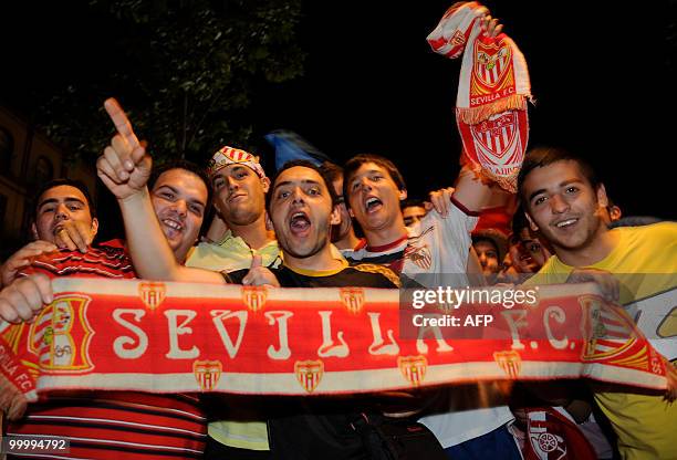 Sevilla's supporters celebrates their team's victory after winning the King's Cup final match against Atletico Madrid on May 19, 2010 in Seville....
