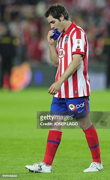 Atletico Madrid's captain Antonio Lopez reats after Sevilla won the King's Cup final match against Atletico Madrid at the Camp Nou stadium in...