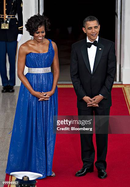President Barack Obama and First Lady Michelle Obama wait to greet Mexican President Felipe Calderon and his wife on the North Portico of the White...