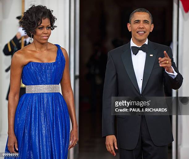 President Barack Obama and US First Lady Michelle Obama, wait for the arrival of the Mexican President and his wife May 19, 2010 for State Dinner...
