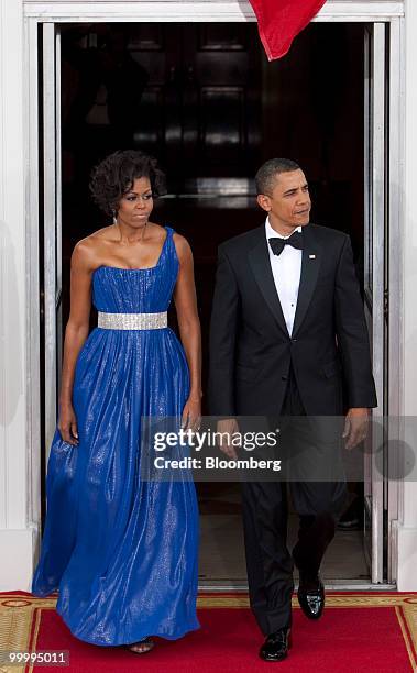President Barack Obama and First Lady Michelle Obama walk out to the North Portico of the White House to greet Mexican President Felipe Calderon and...