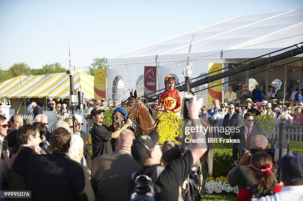 Preakness Stakes: Martin Garcia victorious aboard Lookin At Lucky during Winner's Circle celebration after winning 135th Running at Pimlico Race...