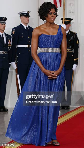 First lady Michelle Obama and her husband U.S President Barack Obama wait for Mexican President Felipe Calderon and his wife Margarita Zavala to...