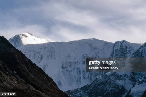 view on mountain belukha in altai region near board of russia and kazakhstan - region stock pictures, royalty-free photos & images