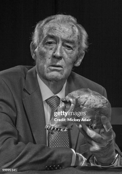 April 1: Paleoanthropologist Richard Leakey poses with a cast of the skull of the homo erectus "Turkana Boy" on the stage of The Fallon Theater on...