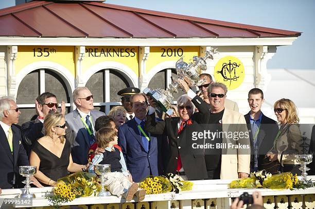 Preakness Stakes: Lookin at Lucky trainer Bob Baffert victorious with Woodlawn Vase trophy during celebration after winning 135th Running at Pimlico...