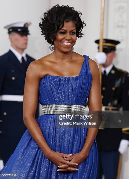 First lady Michelle Obama and her husband U.S President Barack Obama wait for Mexican President Felipe Calderon and his wife Margarita Zavala to...