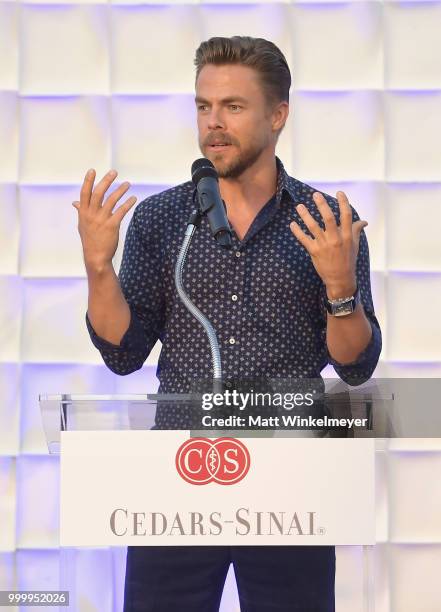 Derek Hough speaks onstage during the 33rd Annual Cedars-Sinai Sports Spectacular at The Compound on July 15, 2018 in Inglewood, California.