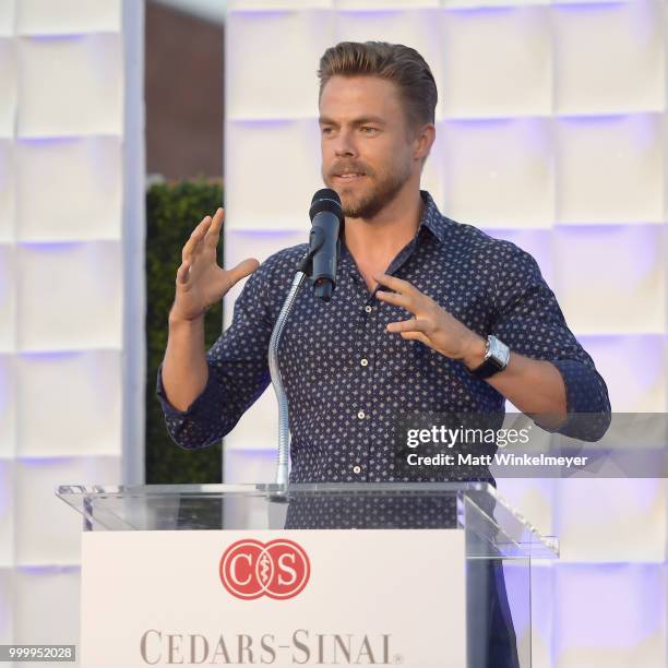 Derek Hough speaks onstage during the 33rd Annual Cedars-Sinai Sports Spectacular at The Compound on July 15, 2018 in Inglewood, California.