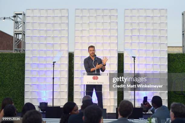 Derek Hough speaks onstage during the 33rd Annual Cedars-Sinai Sports Spectacular at The Compound on July 15, 2018 in Inglewood, California.