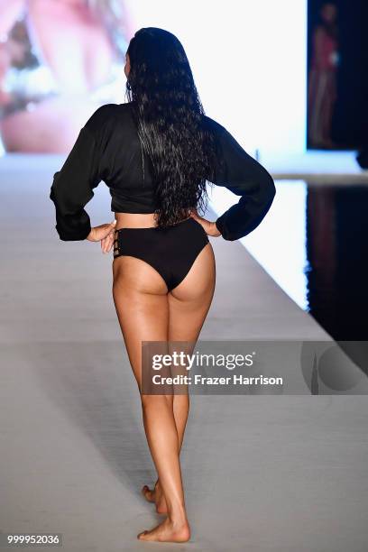 Model walks the runway for the 2018 Sports Illustrated Swimsuit show at PARAISO during Miami Swim Week at The W Hotel South Beach on July 15, 2018 in...