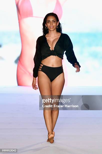 Model walks the runway for the 2018 Sports Illustrated Swimsuit show at PARAISO during Miami Swim Week at The W Hotel South Beach on July 15, 2018 in...