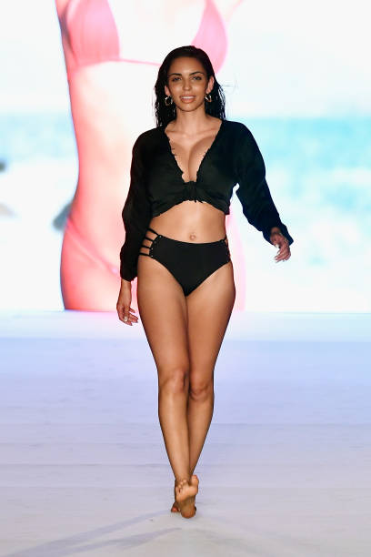 Model walks the runway for the 2018 Sports Illustrated Swimsuit show at PARAISO during Miami Swim Week at The W Hotel South Beach on July 15, 2018 in...