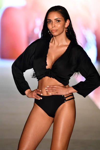 Model walks the runway for the 2018 Sports Illustrated Swimsuit show at PARAISO during Miami Swim Week at The W Hotel South Beach on July 15, 2018 in...