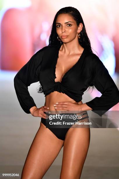 Model walks the runway for the 2018 Sports Illustrated Swimsuit show at PARAISO during Miami Swim Week at The W Hotel South Beach on July 15, 2018 in...