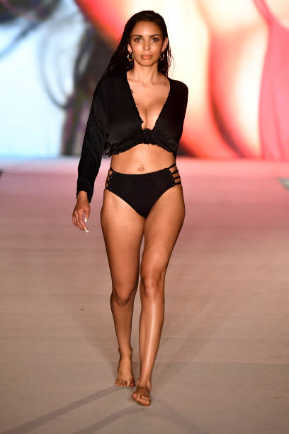 Model walks the runway for the 2018 Sports Illustrated Swimsuit show at PARAISO during Miami Swim Week at The W Hotel South Beach on July 15, 2018 in...