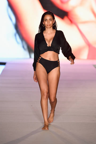 Model walks the runway for the 2018 Sports Illustrated Swimsuit show at PARAISO during Miami Swim Week at The W Hotel South Beach on July 15, 2018 in...
