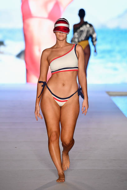 Model walks the runway for the 2018 Sports Illustrated Swimsuit show at PARAISO during Miami Swim Week at The W Hotel South Beach on July 15, 2018 in...
