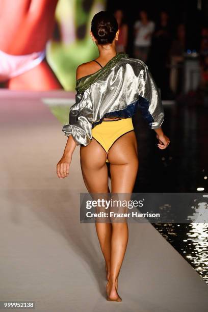 Model walks the runway for the 2018 Sports Illustrated Swimsuit show at PARAISO during Miami Swim Week at The W Hotel South Beach on July 15, 2018 in...