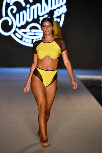 Model walks the runway for the 2018 Sports Illustrated Swimsuit show at PARAISO during Miami Swim Week at The W Hotel South Beach on July 15, 2018 in...