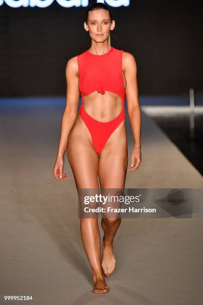 Model walks the runway for the 2018 Sports Illustrated Swimsuit show at PARAISO during Miami Swim Week at The W Hotel South Beach on July 15, 2018 in...