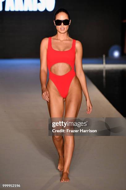 Model walks the runway for the 2018 Sports Illustrated Swimsuit show at PARAISO during Miami Swim Week at The W Hotel South Beach on July 15, 2018 in...