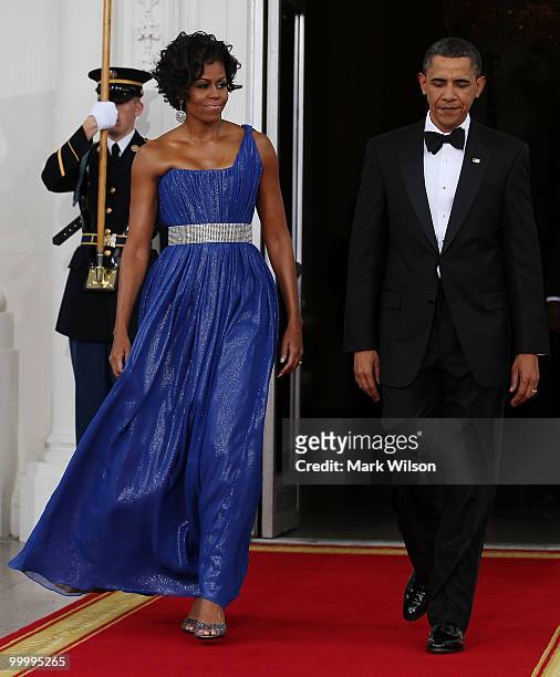 President Barack Obama and his wife first lady Michelle Obama walk out to greet Mexican President Felipe Calderon and his wife Margarita Zavala after...