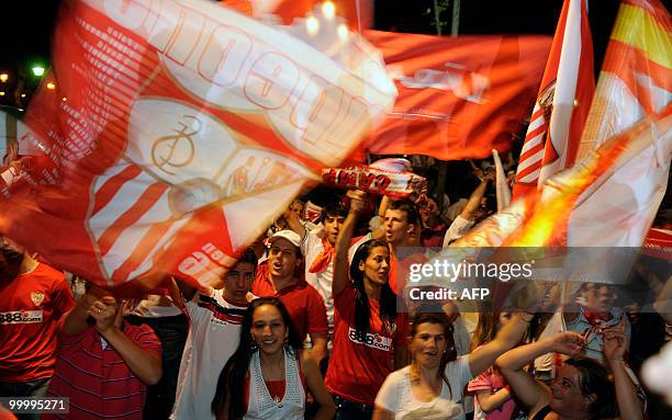 Sevilla's supporters celebrates with flags their team's victory after winning the King's Cup final match against Atletico Madrid on May 19, 2010 in...