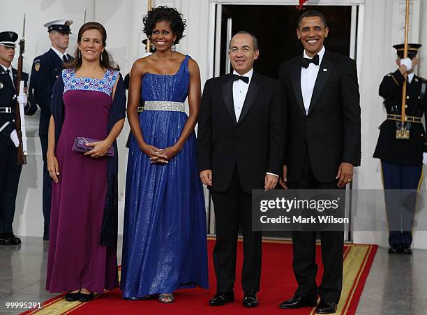 President Barack Obama , and his wife first lady Michelle Obama , stand with Mexican President Felipe Calderon and his wife Margarita Zavala after...