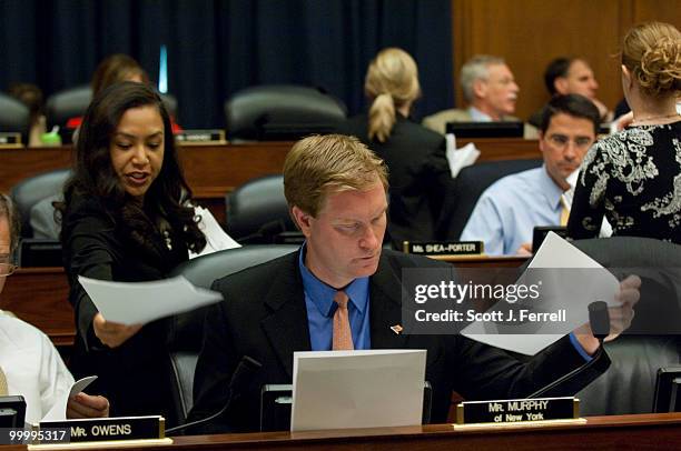 May 19: An aide passes an amendment to Rep. Scott Murphy, D-N.Y., during the House Armed Services markup of the fiscal 2011 defense authorization...