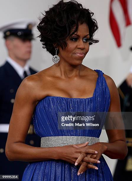 First lady Michelle Obama and her husband U.S President Barack Obama wait for Mexican President Felipe Calderon and his wife Margarita Zavala to...