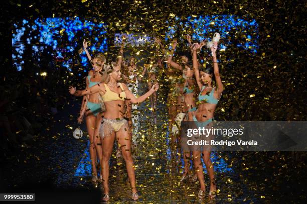 Models walk the runway for Kya Swim during the Paraiso Fasion Fair at The Paraiso Tent on July 15, 2018 in Miami Beach, Florida.