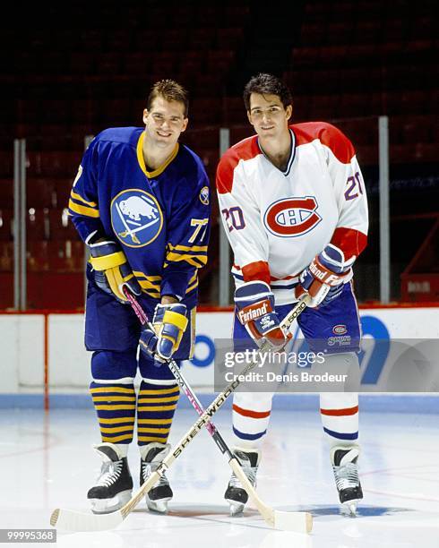 Pierre Turgeon of the Buffalo Sabres poses with older brother Sylvain Turgeon of the Montreal Canadiens in the early 1990's at the Montreal Forum in...