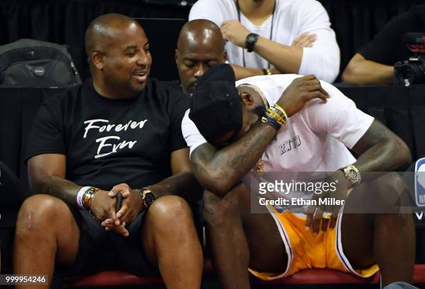 Randy Mims looks on as LeBron James of the Los Angeles Lakers cracks up as they attend a quarterfinal game of the 2018 NBA Summer League between the...