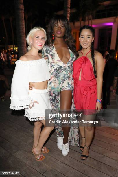 Genevieve Shaffer, Tayo Otiti and Heidi Malaret attend the 2018 Sports Illustrated Swimsuit party at PARAISO during Miami Swim Week at The W Hotel...