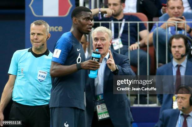 Coach of France Didier Deschamps talks to Paul Pogba during the 2018 FIFA World Cup Russia Final between France and Croatia at Luzhniki Stadium on...