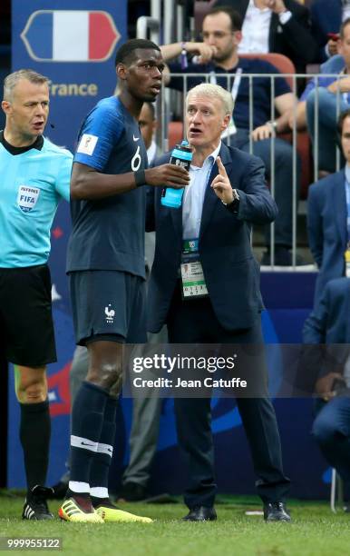 Coach of France Didier Deschamps talks to Paul Pogba during the 2018 FIFA World Cup Russia Final between France and Croatia at Luzhniki Stadium on...