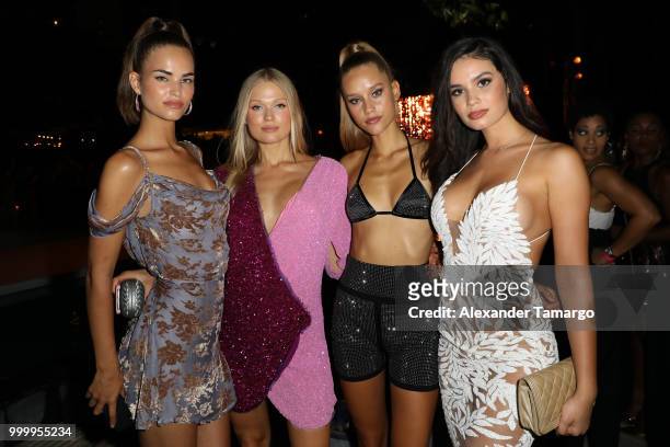 Robin Holzken, Vita Sidorkina, Chase Carter and Anne de Paula attend the 2018 Sports Illustrated Swimsuit show at PARAISO during Miami Swim Week at...