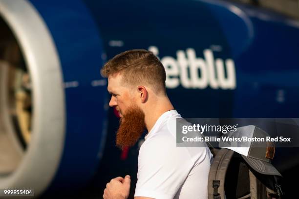 Craig Kimbrel of the Boston Red Sox boards the plane during a team charter flight to Washington, DC for the 2018 Major League Baseball All-Star Game...