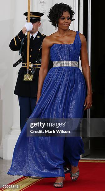 First lady Michelle Obama walks with her husband U.S President Barack Obama to greet Mexican President Felipe Calderon and his wife Margarita Zavala...