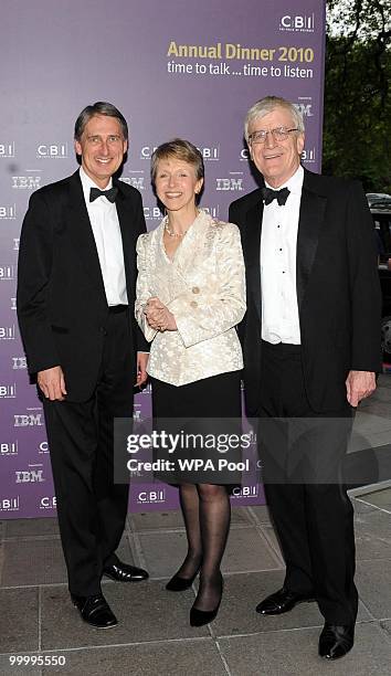 Transport secretary Philip Hammond is greeted by President of the CBI Helen Alexander and CBI Director General Richard Lambert as he arrives for the...