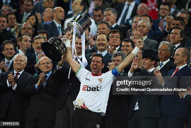 Andres Palop of Sevilla holds up the trophy after the Copa del Rey final between Atletico de Madrid and Sevilla at Camp Nou stadium on May 19, 2010...