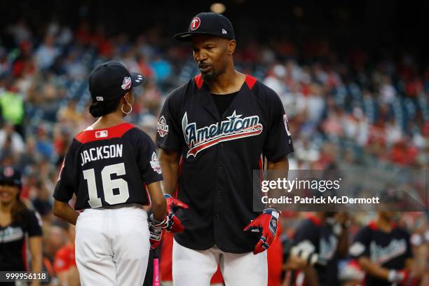 Skai Jackson and Jamie Foxx talk during the All-Star and Legends Celebrity Softball Game at Nationals Park on July 15, 2018 in Washington, DC.