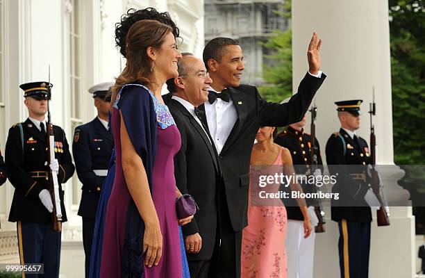 President Barack Obama, right to left, Felipe Calderon, Mexico's president, First Lady Michelle Obama, and Margarita Zavala, wife of Calderon, pose...