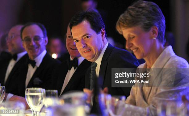 Chancellor of the Exchequer George Osborne sits alongside President of the CBI Helen Alexander as he attends the British Industry's annual dinner at...