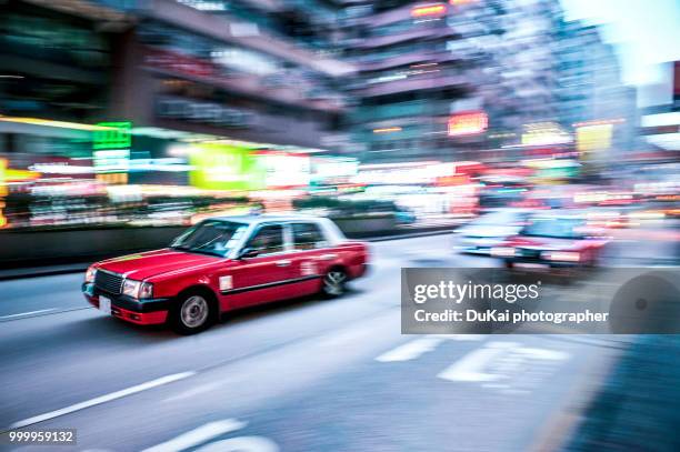 hong kong taxi in mong kok - dukai stock pictures, royalty-free photos & images