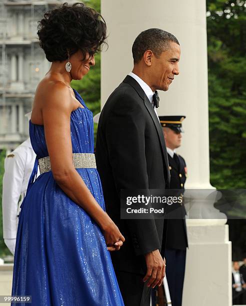 President Barack Obama and first lady Michelle Obama wait to welcome Mexican President Felipe Calderon and first lady Margarita Zavala on the North...