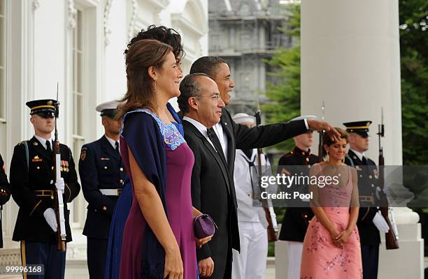 President Barack Obama and first lady Michelle Obama welcome Mexican President Felipe Calderon and first lady Margarita Zavala on the North Portico...